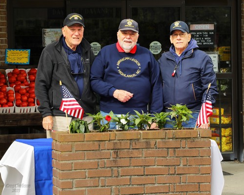 Post 370 Legionnaires giving away poppies at Bryson's Grocery.